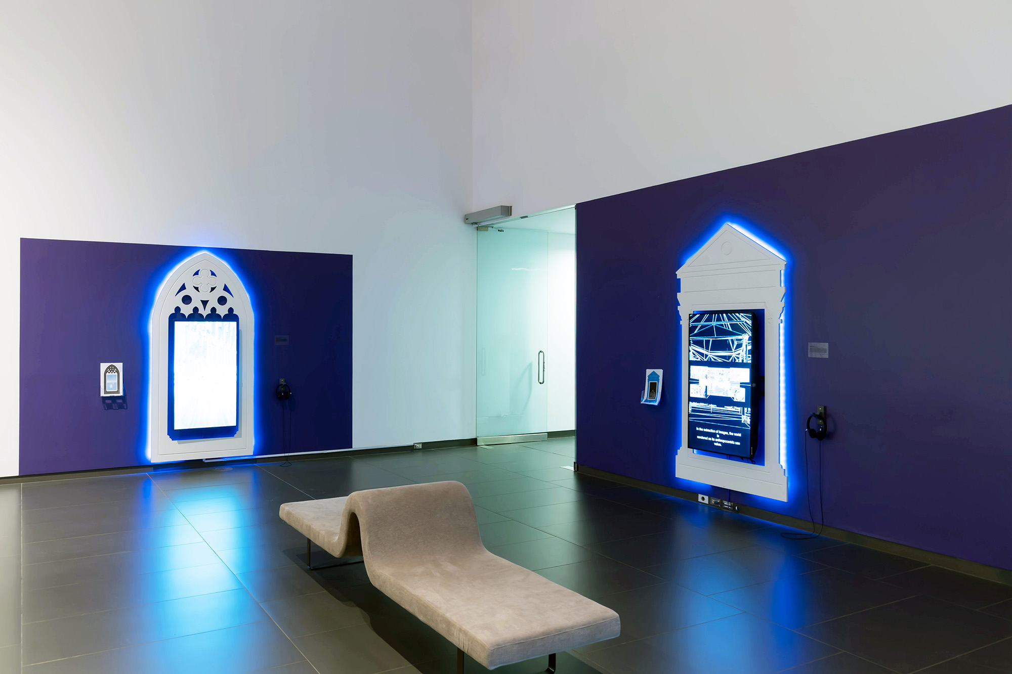 Installation view at Art Gallery of Grande Prairie showing Blindspot and Crowd Control as single-channel machinima video installations.