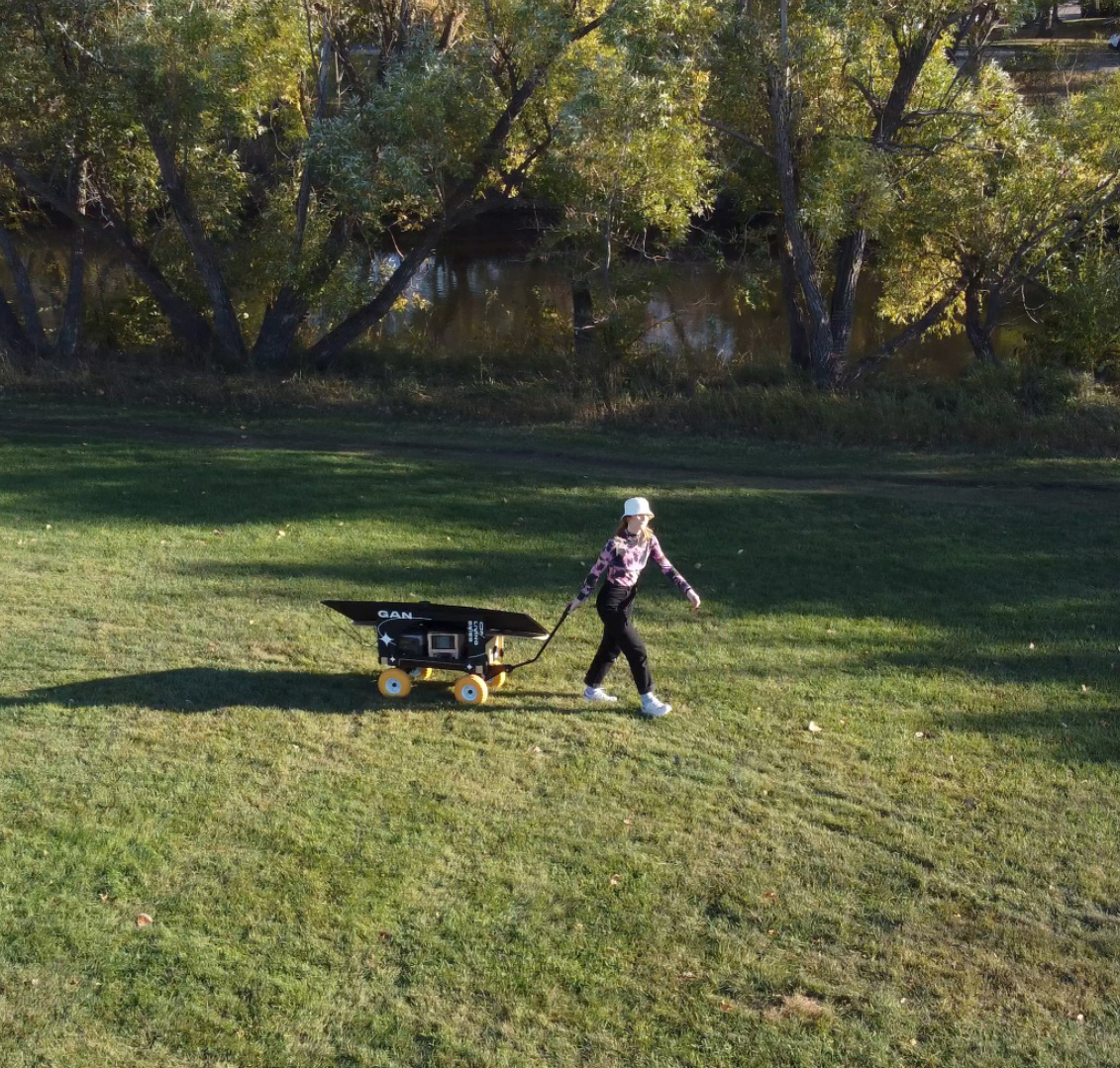 Aerial view of the artist activating the WaGAN cart outside Art Gallery of Regina.