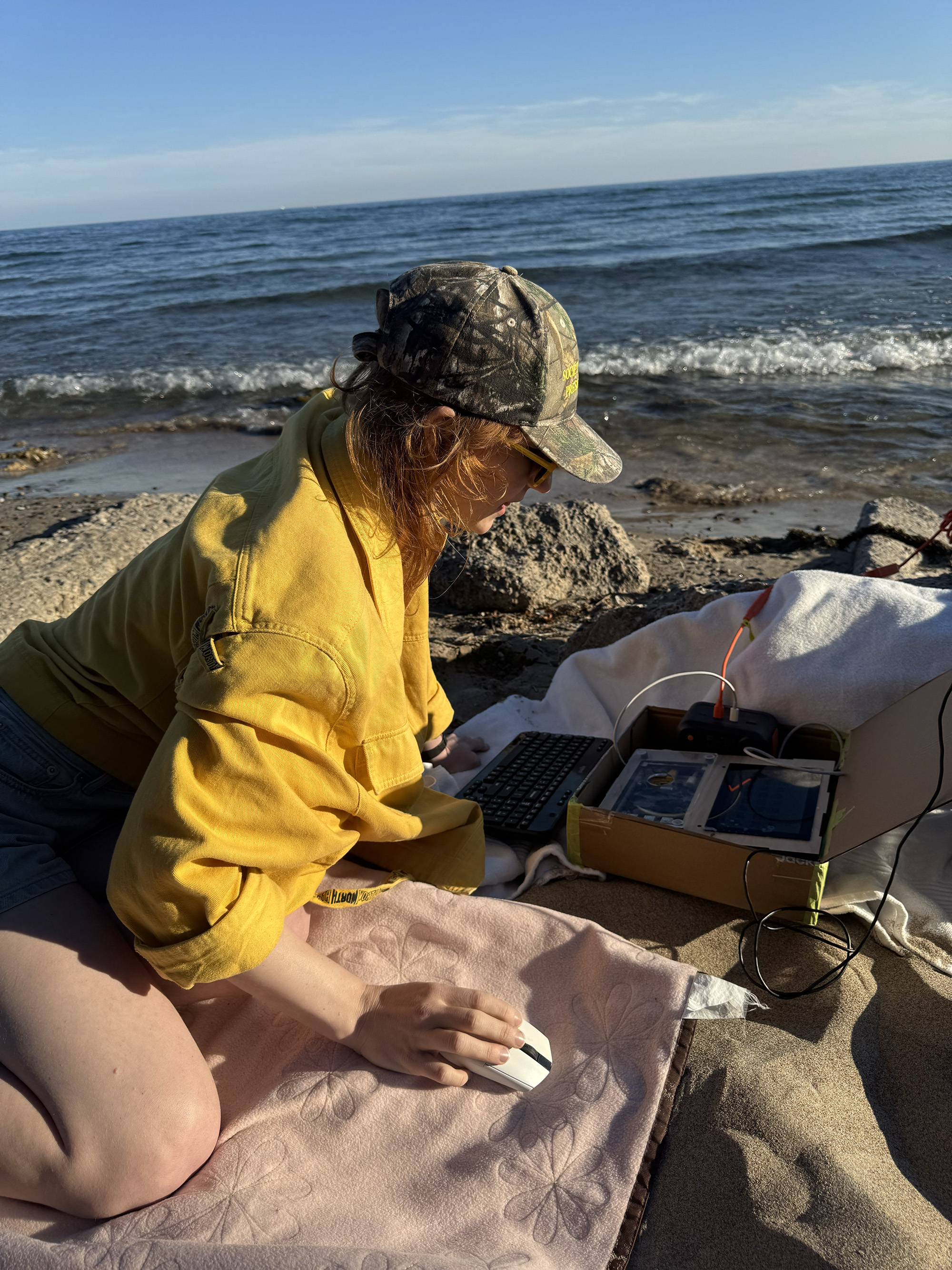 The artist operating a slimmed-down portable version of the WaGAN on the beach at Gibraltar Point.