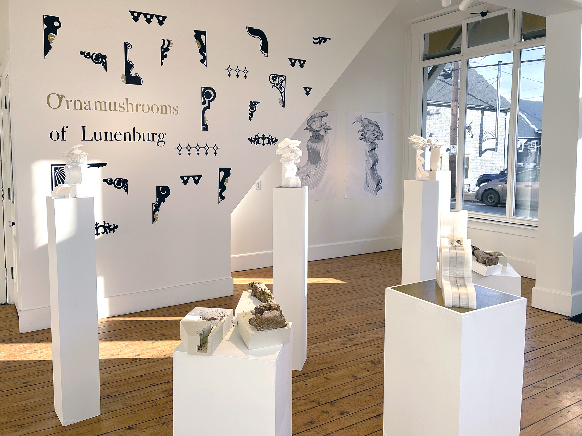 Ornamushroom mycelium sculptures and their digital 3D renderings displayed together in the gallery.