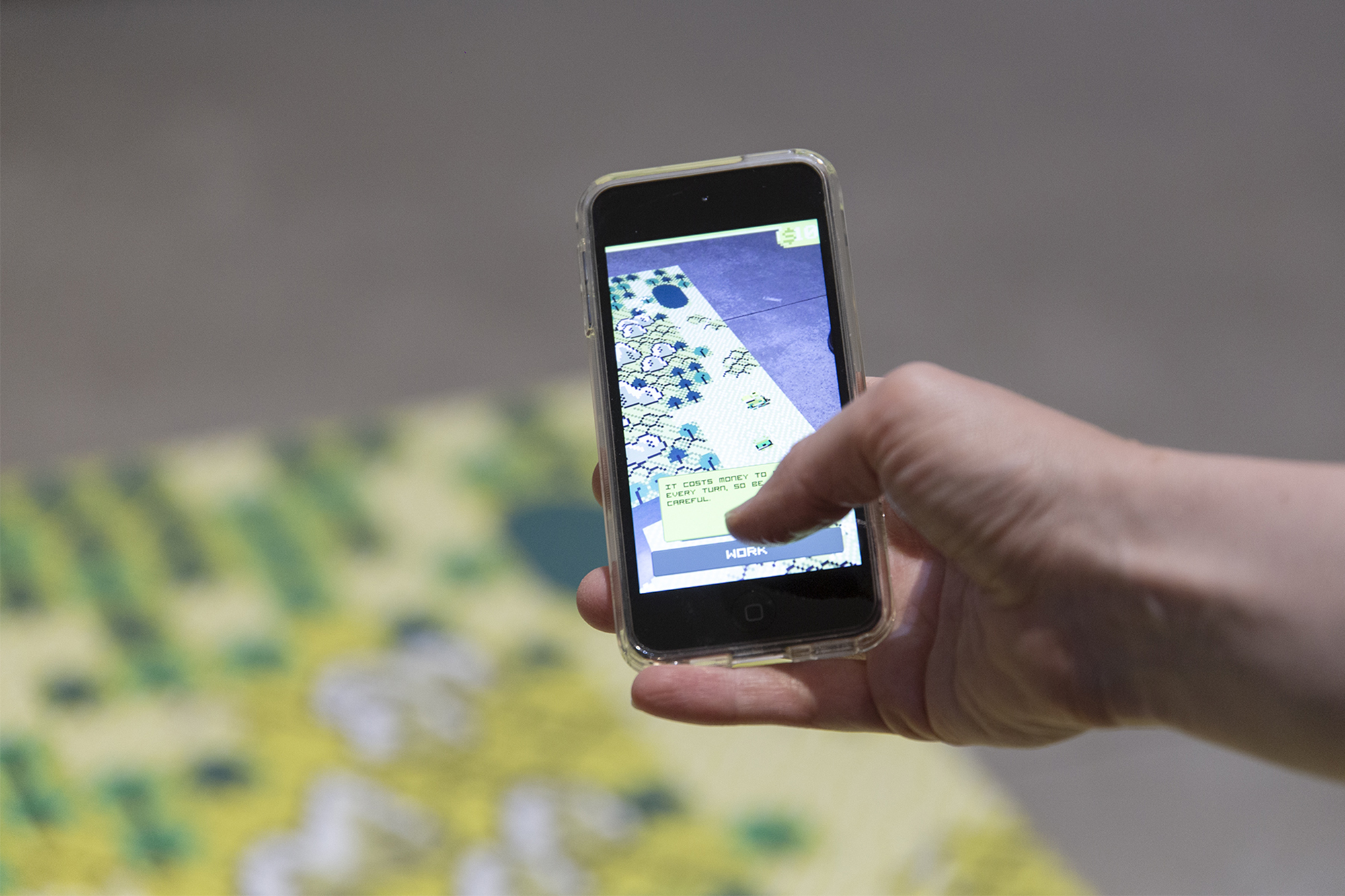Audience members using their phones to activate the augmented reality map and play the Reality Crossing game.